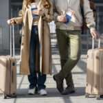A traveler’s essentials, including a passport, travel insurance documents, and a suitcase, symbolizing preparation and security for an international journey.