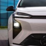 2026 Chevrolet Bolt EV charging at a Tesla Supercharger