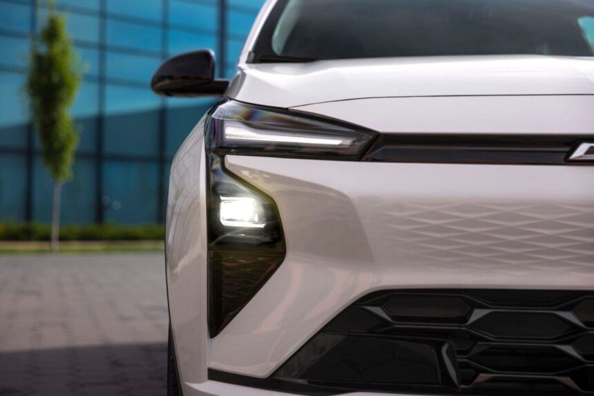 2026 Chevrolet Bolt EV charging at a Tesla Supercharger